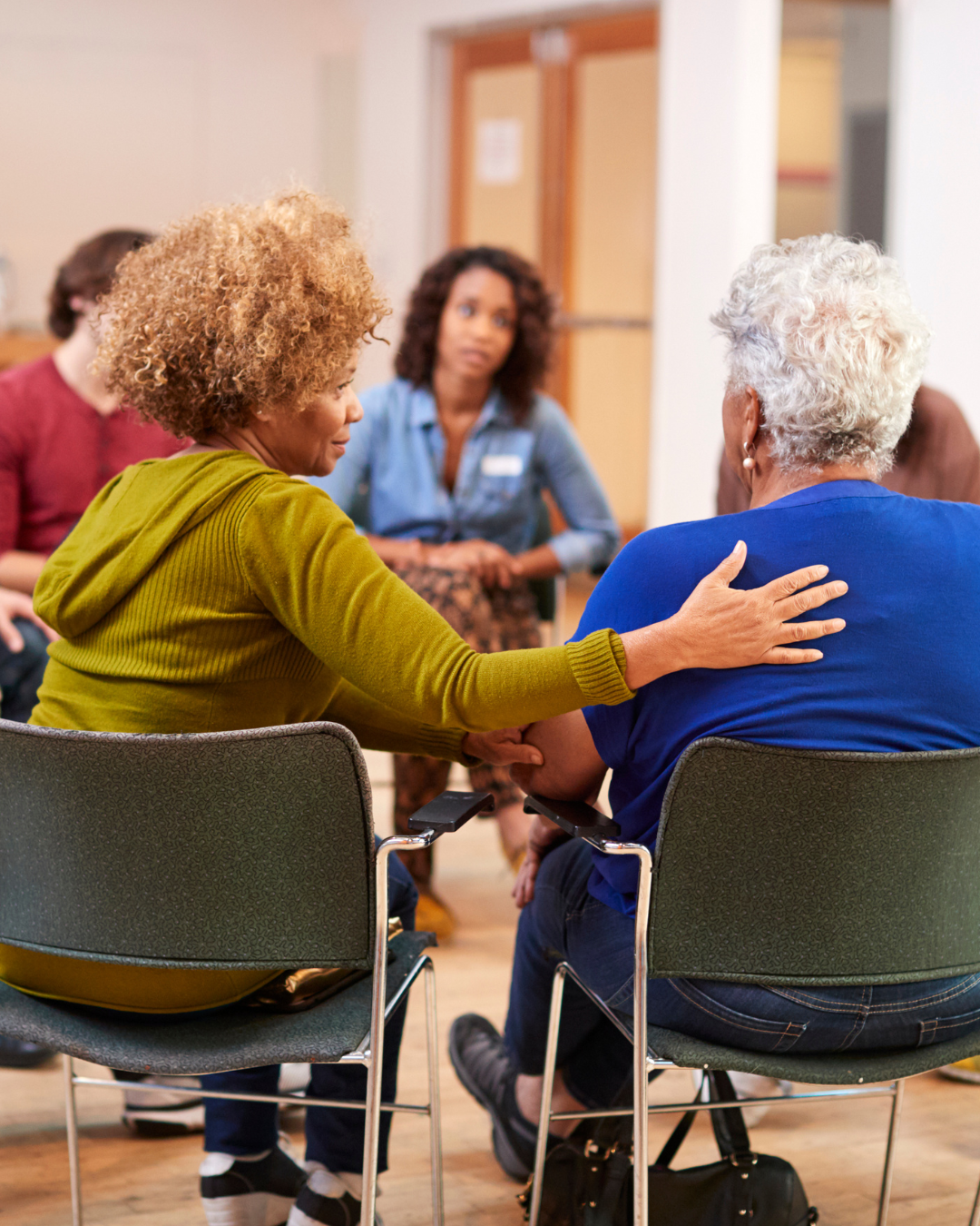 Elderly man smiling with caregiver