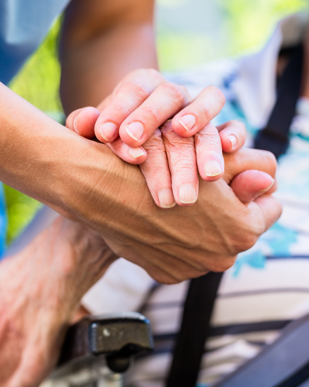 Elderly man smiling with caregiver
