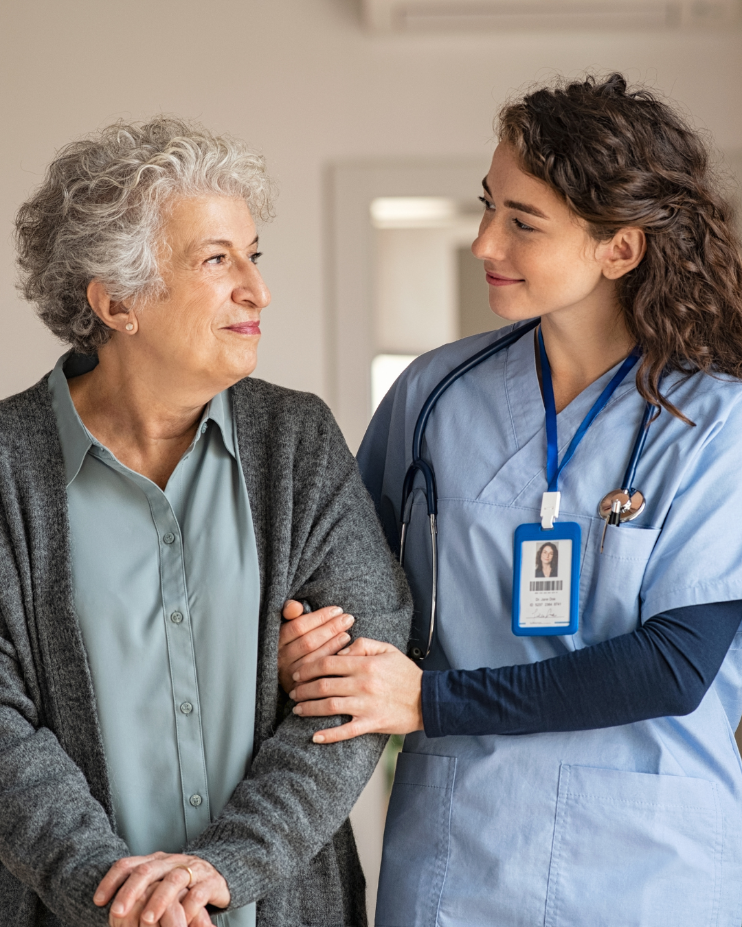 Elderly man smiling with caregiver