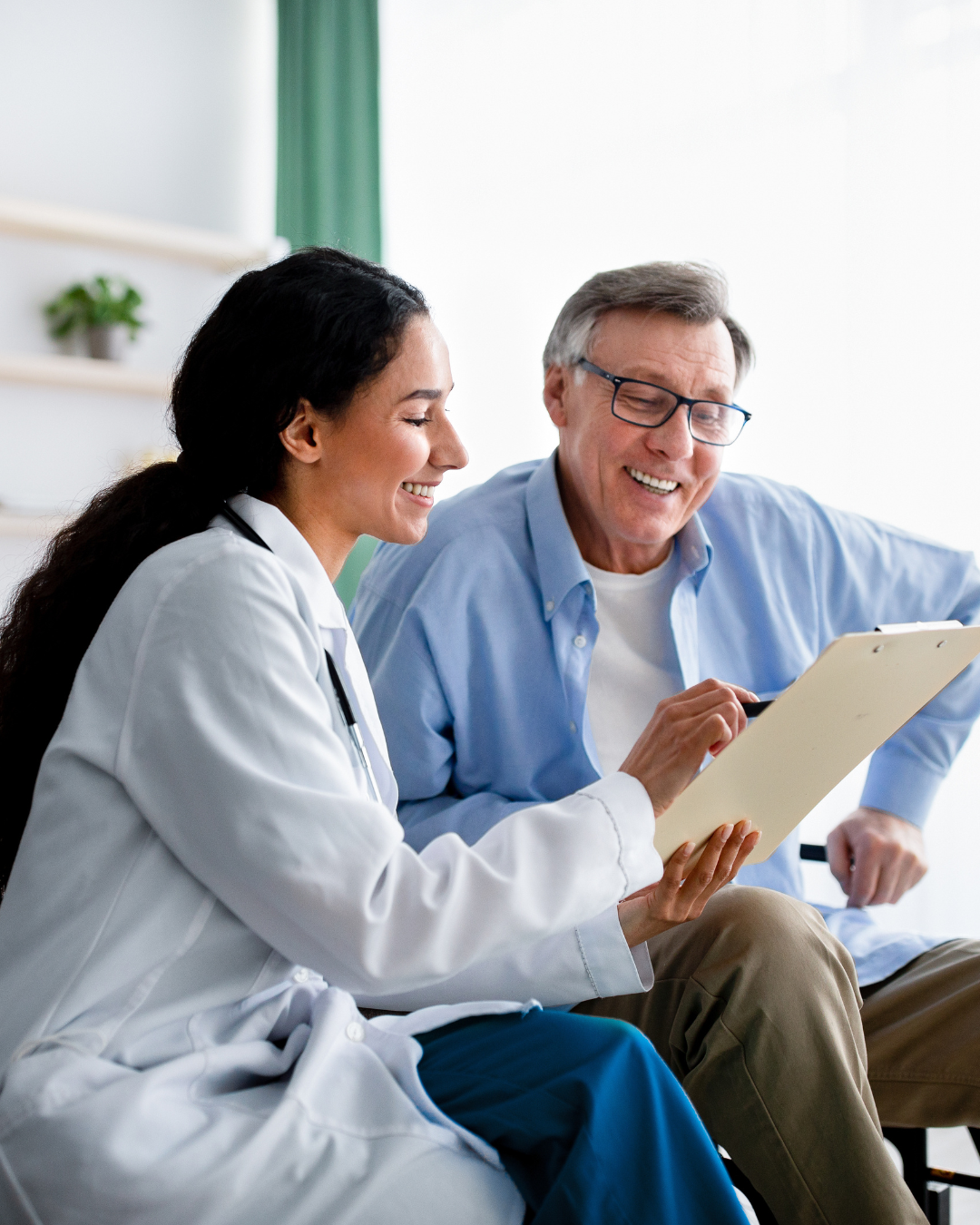 Elderly man smiling with caregiver