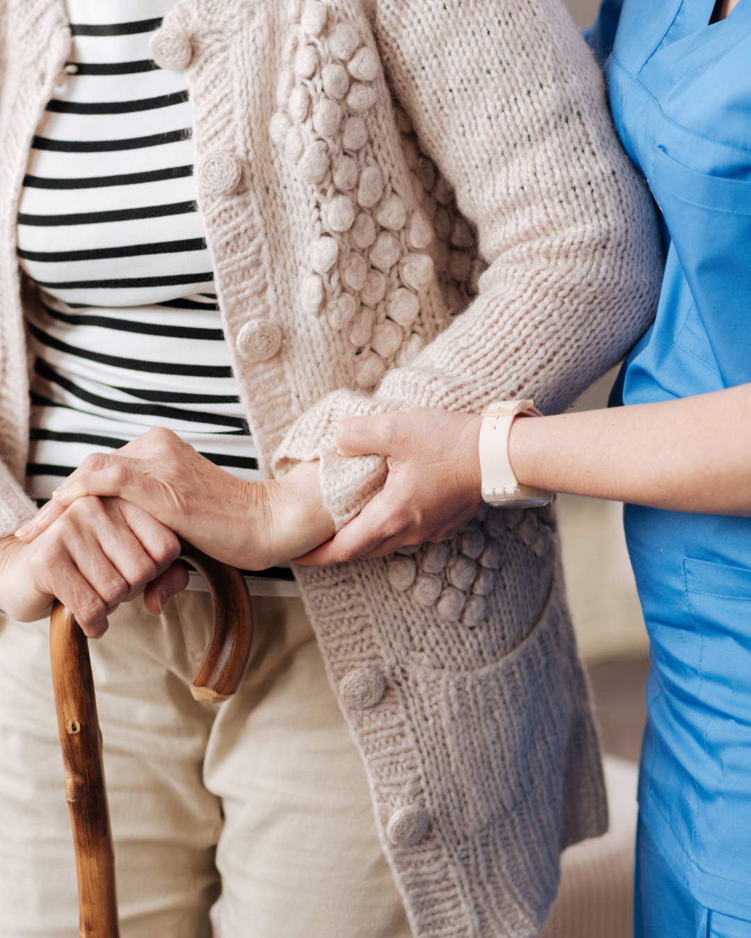 Elderly woman getting assisted by Nursing Care service provider